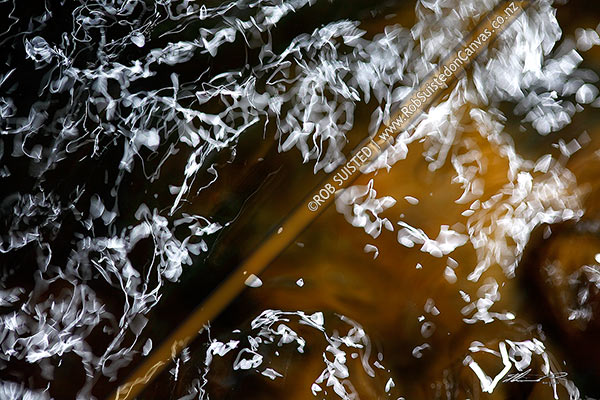 Photo of Abstract streaks of light on water surface,, New Zealand (NZ)