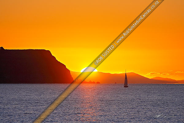 Photo of Sunset over the South Island on the far side of Cook Strait from Mana Island (left) and homeward bound sail boat yacht into Paremata, Plimmerton, Porirua City, Wellington Region, New Zealand (NZ)