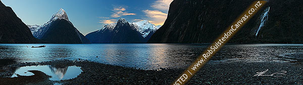 Photo of Mitre Peak reflecting in Milford Sound. Mitre Peak left (1683m), The Lion (1302m) and Mt Pembroke (2015m) centre. Panorama at dawn, Milford Sound, Fiordland National Park, Southland, Southland Region, New Zealand (NZ)