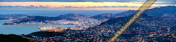 Photo of Wellington Harbour, CBD and City at twilight with lights glowing. Panorama from Evans Bay / airport to Wadestown / Karori (right), Cook Strait beyond, Wellington City, Wellington City, Wellington Region, New Zealand (NZ)