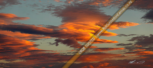 Photo of Unusual fiery orange sunset clouds in an evening sky. Panorama file,, New Zealand (NZ)