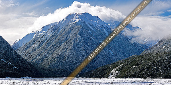 Photo of Bealey River Valley (left) with Mount O'Malley (1703m) cloaked in heavy winter snowfall. Mingha River valley right, Arthur's Pass National Park, Selwyn, Canterbury Region, New Zealand (NZ)