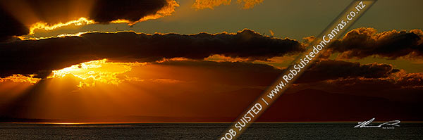Photo of Dramatic sunset over Tasman Bay, Rabbit Island and Tahunanui Beach. Panorama, Nelson, Nelson City, Nelson Region, New Zealand (NZ)