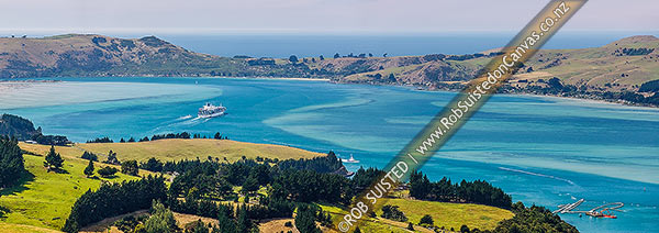 Photo of Otago Harbour with large container ship leaving Port Chalmers. Otago Peninsula and Te Rauone Beach beyond. Harbour channel dredging bottom right. Panorama, Port Chalmers, Dunedin City, Otago Region, New Zealand (NZ)