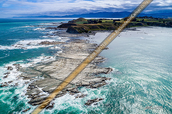 Photo of Point Kean wave platforms of the NE point of the Kaikoura Peninsula, a popular seal viewing site for tourists to visit. Uplifted by m7.8 Kaikoura Earthquake. Aerial view, Kaikoura, Kaikoura, Canterbury Region, New Zealand (NZ)