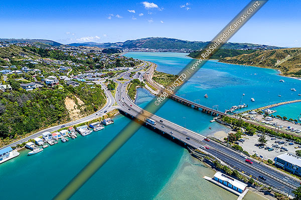 Photo of Porirua Harbour, with Pauatahanui Inlet at bottom left. Paremata left, Mana Marina and Mana at right, Paremata far left. Porirua City and Colonial Knob in distance. Aerial view, Mana, Porirua City, Wellington Region, New Zealand (NZ)