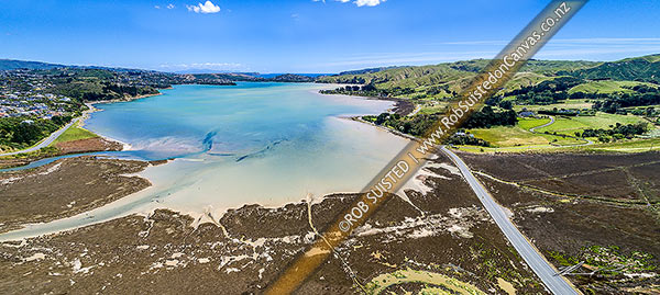 Photo of Pauatahanui Inlet of Porirua Harbour from air. Pauatahanui Stream and Whitby far left, Wildlife Reserve below, and Grays Road, Ration Point right. Aerial view panorama, Pauatahanui, Porirua City, Wellington Region, New Zealand (NZ)