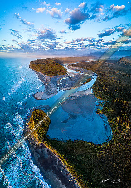 Photo of Wanganui Heads, River mouth and tidal lagoon. Mt Oneone (56m) bottom left, Wanganui Bluff above. Southern Alps beyond. Moody aerial view at dusk, Harihari, Westland, West Coast Region, New Zealand (NZ)