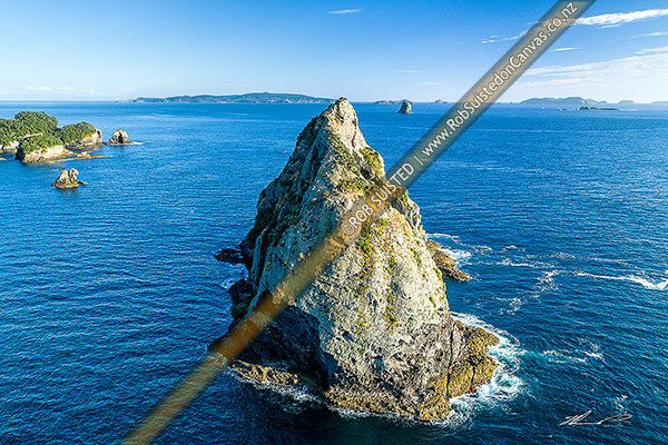 Photo of Needle Rock in the Hole in the Wall Channel, with Mercury Islands in distance. Aerial view, Opito Bay, Coromandel Peninsula, Thames-Coromandel, Waikato Region, New Zealand (NZ)