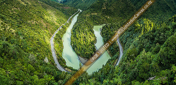 Photo of Waioeka River and gorge, with State Highway 2 winding through. Waioeka Gorge Scenic Reserve. Aerial panorama looking upstream over major bend, Waioeka Gorge, Opotiki, Bay of Plenty Region, New Zealand (NZ)