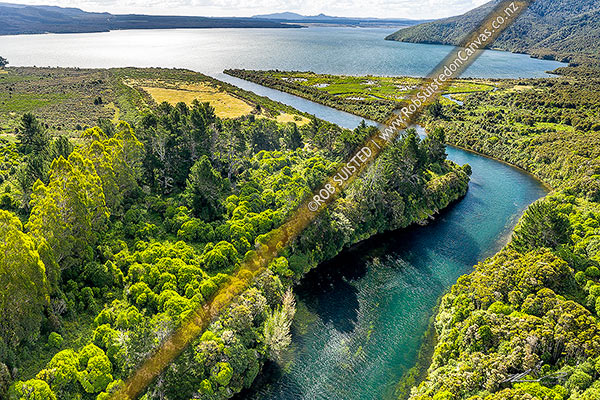 Photo of Lake Rotoaira outlet at Poutu Stream. Historic site of Lieutenant Colonel McDonnell's 1869 Redoubt camp, while pursuing Te Kooti, in foreground. Aerial view, Lake Rotoaira, Taupo, Waikato Region, New Zealand (NZ)