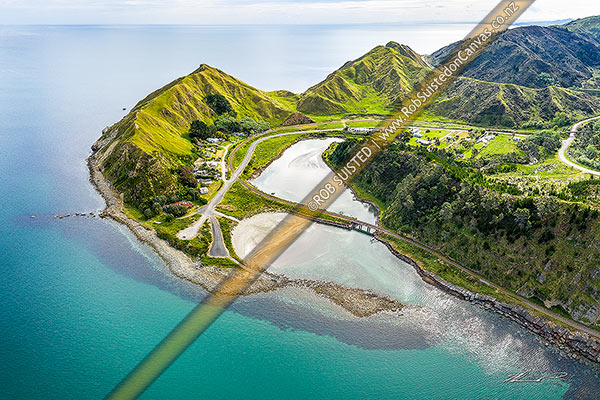 Photo of Waikokopu at Opoutama, where Waikokopu Stream creates a small habour crossed by the Palmerston North to Gisborne Railway line. Looking out over northern Hawke Bay. Aerial view, Mahia, Wairoa, Hawke's Bay Region, New Zealand (NZ)