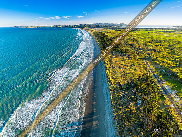 Photo of Pukenui Beach, looking towards Mahia township and Mahia Peninsula, looking across the isthmus. Aerial view, Mahanga Beach, Wairoa, Hawke's Bay Region, New Zealand (NZ)
